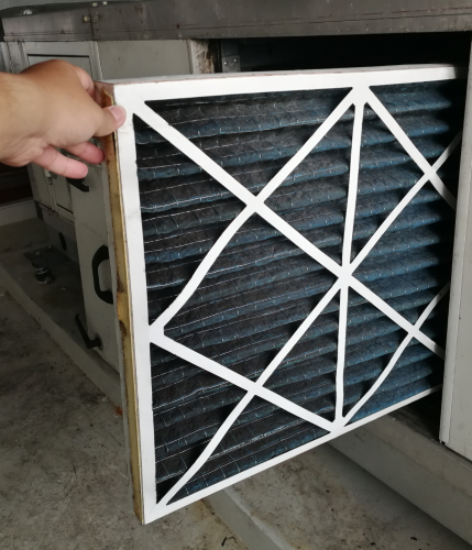 person taking out an HVAC filter
